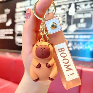 Cute capybara keychain with strap, cartoon animal bag pendant and car key ring accessory.