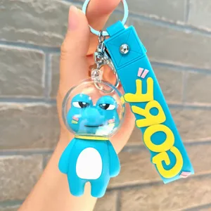 Detailed view of the cute blue astronaut frog keychain with transparent helmet and strap.
