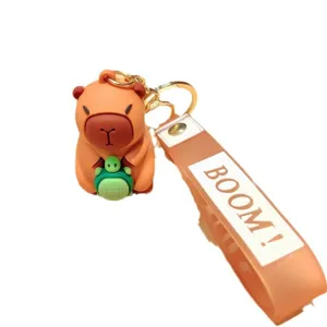 Cute capybara keychain with turtle charm, silicone pendant accessory for bags and keys.