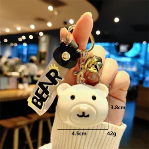 Cute bear acrylic keychain and bag charm, adorable cartoon pendant for keys and accessories.