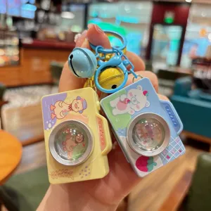 Detailopname van de schattige cartoon camera sleutelhanger, mini poloid tas hanger.