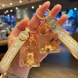 Cute capybara liquid acrylic keychain with glitter charm, perfect bag pendant gift.