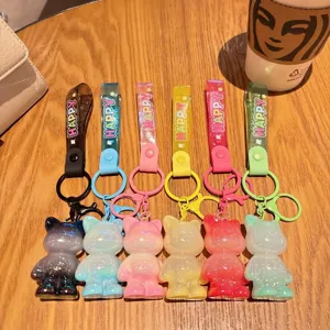 Cute acrylic bear keychain with colorful strap, perfect bag charm and gift accessory.