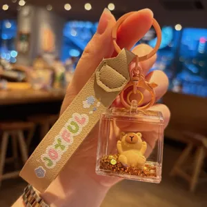 Cute acrylic capybara liquid keychain with wrist strap, oil filled glitter quicksand bag pendant.