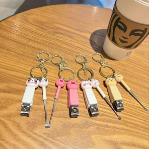 Cute cartoon animal nail clipper and ear pick keychain set, portable bag pendant gift.