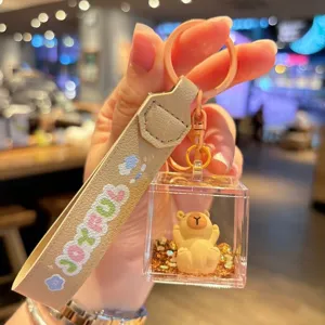 Cute capybara liquid keychain with acrylic drifting sand bottle, perfect bag charm and gift.