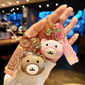 Cute cartoon bear head keychain and bag pendant set with bells and stylish straps for daily use.