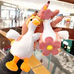 Adorable plush white goose keychain detail view, soft stuffed animal bag pendant accessory.