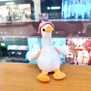Cute white duck plush keychain with mini backpack and hat, soft toy bag pendant gift.