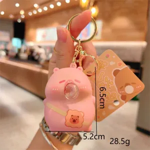 Detailed close-up shot of the cute pink bear bubble-blowing stress relief keychain pendant.