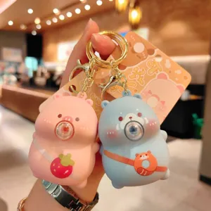Cute cartoon squeeze keychain pair, kawaii stress relief backpack charm and car key ring set.