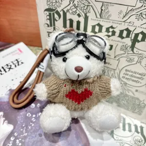 Adorable porte-clés en peluche ours avec lunettes et pull, parfait pendentif de sac mignon.