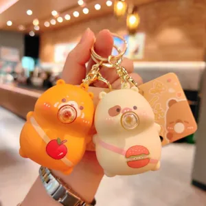 Cute cartoon bear keychain detail shot, showing squeeze bubble design and adorable hanging pendant.