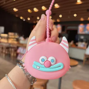 Niedlicher rosa Silikon Monster Münzbeutel Schlüsselanhänger, tragbare Mini Kopfhörertasche.