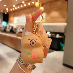 Detailed view of the cute cartoon decompression keychain with bubble design and bag pendant.