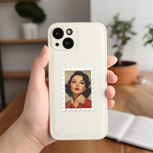 Detailed view of a white leather phone case with a retro pin-up beauty stamp sticker.
