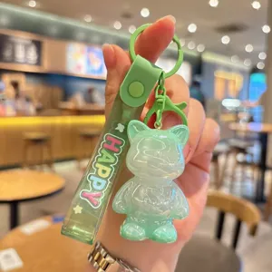 Green cute acrylic cat keychain with strap pendant, stylish bag charm and key ring accessory.