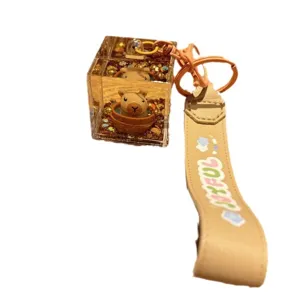 Cute capybara liquid quicksand bottle keychain with leather strap for backpack and keys.