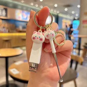 Cute cat nail clipper and ear pick keychain set, creative bag pendant and portable gift keyring.