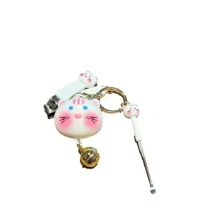 Cute cartoon animal nail clipper keychain with ear pick and bell pendant for bags and keys.