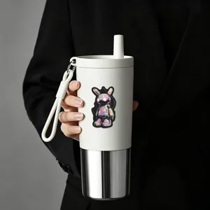 Stainless steel insulated tumbler with cyberpunk mecha rabbit sticker and portable silicone strap.