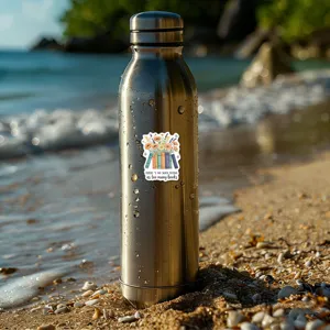 Close-up detail of literary book sticker with floral design displayed on a stainless steel bottle.