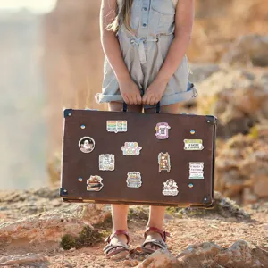Showcase of waterproof reading book stickers applied on a suitcase, literary aesthetic style.