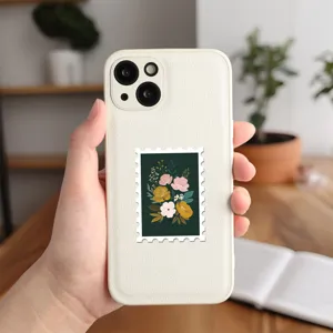 Detailed view of white leather texture phone case with vintage floral stamp sticker design.