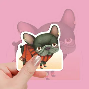 Close-up detail of a cute cartoon French bulldog sticker with scarf, perfect for DIY journaling.