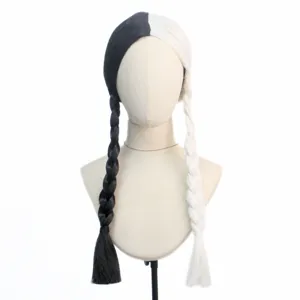 Detail view of the black and white split color braided wig, showcasing neat pigtails.