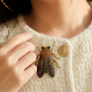 Vintage rhinestone cicada brooch fashion metal insect pin for women clothing accessories.