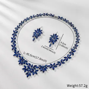 Detailed view of blue crystal leaf necklace earrings set, elegant jewelry detail shot.