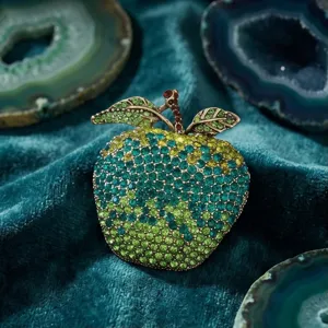 Gradient apple rhinestone brooch close-up, luxury green crystal fruit pin for women fashion.