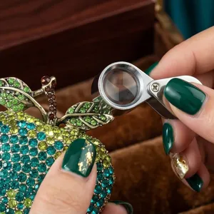 Exquisite gradient rhinestone apple brooch, detailed close-up shot showcasing fine craftsmanship.