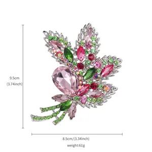 Exquisite crystal rhinestone brooch detail, sparkling pink green gems, elegant silver pin.