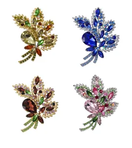 Detailed view of luxury crystal glass rhinestone brooch, elegant leaf pin for clothing.