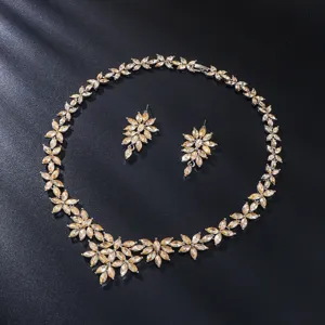 Detailed view of luxury rhinestone necklace and earrings set featuring sparkling marquise crystals.