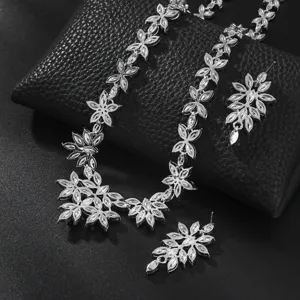 Exquisite silver-tone rhinestone flower necklace and earrings detail view for women