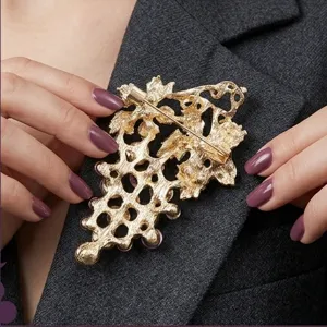 Detailed view of the vintage grape brooch back pin structure, elegant gold tone design.