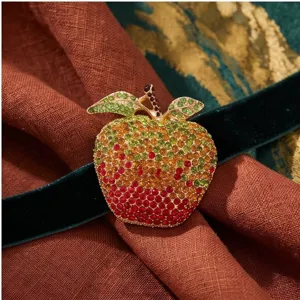 Detailed close-up of a stunning full rhinestone gradient apple brooch with vibrant crystals.