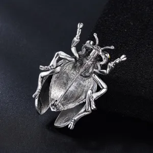 Vintage silver cicada insect brooch detail shot, back pin structure and metallic texture display