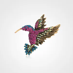 Exquisite hummingbird crystal brooch featuring colorful rhinestones, vintage gold-tone.