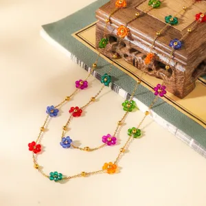 Colorful beaded flower necklace with metallic chain, sweet and elegant jewelry accessory.