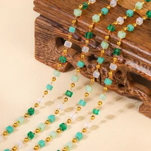 Green cube bead necklace detail shot, elegant gold link chain with mint and clear square charms.