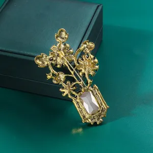 Exquisite detail view showing the secure back pin clasp craftsmanship of vintage gold flower brooch.