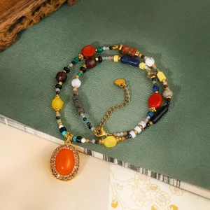 Chic multi-color gemstone beaded clavicle necklace with vintage oval pendant, elegant retro style.