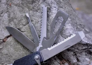 Multi-function outdoor survival pocket knife tool with stainless steel blades and saw.
