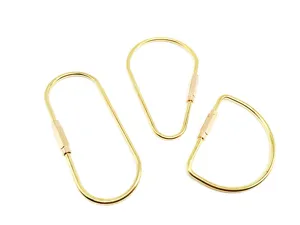 Brass keychain set featuring oval, pear, and D-shape screw rings for EDC and outdoor use.