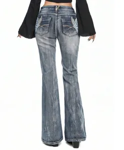 Back detail of women's vintage wash stretch denim flared jeans with stylish back pocket embroidery.