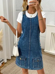 Casual washed denim overall dress for women, featuring front pockets and stylish button details.